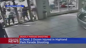 Surveillance video shows crowd fleeing deadly mass shooting at Highland Park parade